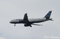 N588JB @ KSRQ - JetBlue Flight 163 (N588JB) Hopelessly Devoted to Blue arrives at Sarasota-Bradenton International Airport following flight from John F Kennedy International Airport - by Donten Photography