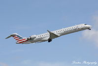 N572NN @ KSRQ - American Flight 5139 operated by PSA (N572NN) departs Sarasota-Bradenton International Airport enroute to Charlotte-Douglas International Airport - by Donten Photography