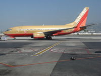 N737JW @ KBUR - Southwest Airlines 1999 737-7H4 in old colors @ Bob Hope Burbank Airport, CA - by Steve Nation