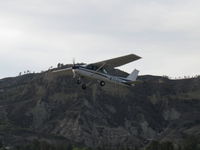 N704UT @ SZP - 1976 Cessna 150M, Continental O-200 100 Hp, takeoff climb Rwy 04 for pattern work - by Doug Robertson