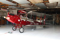 N60MZ @ SZP - 1930 de Havilland DH-60G Gypsy Moth as NX60MZ and also carrying British registration G-AAMZ @ Santa Paula, CA home base (with wings folded and in sunny hangar) - by Steve Nation
