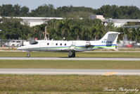 N425M @ KSRQ - Learjet 31 (N425M) departs Sarasota-Bradenton International Airport enroute to Middle Georgia Regional Airport - by Donten Photography
