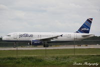 N591JB @ KRSW - JetBlue Flight 904 (N591JB) Tale of Blue Cities departs Southwest Florida International Airport enroute to Bradley International Airport - by Donten Photography