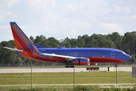 N562WN @ KRSW - Southwest Flight 119 (N562WN) arrives at Southwest Florida International Airport following flight from Port Columbus International Airport - by Donten Photography