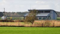 G-NWOI - Off airport. Distant shot of the NPAS helicopter deployed to the Dyfed-Powys Police helipad at Pembrey, Wales, UK. - by Roger Winser