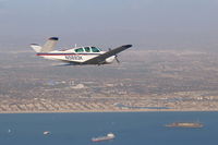 N5693K - 93K flying over Long Beach Bay. Photo by MKoba