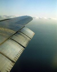 N86516 @ SFO - 1959, over San Francisco Bay - by Mac Hayes