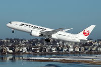 JA830J @ KBOS - Tokyo bound JAL 7 departing against the snowy backdrop of East Boston, Massachusetts. - by Chris Ianno