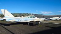 N310H @ KRHV - Locally-based 1964 Cessna 310I looking better than ever (no more flat tires!!) parked at a temporary tie down to make room for all the transient Super Bowl 50 aircraft coming to Reid Hillview Airport, San Jose, CA. - by Chris Leipelt