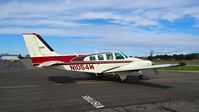 N1054W @ O69 - Gnoss Field-based 1973 Beechcraft Baron 58 taxing out for departure at Petaluma Municipal Airport, Petaluma, CA. - by Chris Leipelt