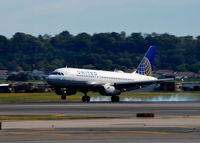 N805UA @ KDCA - Tire smoke on landing National - by Ronald Barker