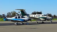 N780JB @ KRHV - Mermerus LLC (Beverly Hills, CA) 2013 Cirrus SR22T Turbo parked on the transient ramp next to a King Air F90 at Reid Hillview Airport, San Jose, CA. - by Chris Leipelt