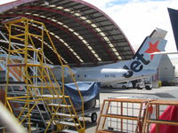 VH-TQL @ NZAA - hiding in hangar prior to entry into NZ service - by magnaman