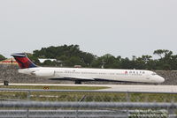 N942DL @ KSRQ - Delta Flight 2298 (N942DL) holds short of Runway 14 at Sarasota-Bradenton International Airport prior to flight to Hartsfield-Jackson Atlanta International Airport - by Donten Photography