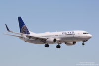 N12225 @ KSRQ - United Flight 1559 (N12225) arrives at Sarasota-Bradenton International Airport following flight from Newark-Liberty International Airport - by Donten Photography