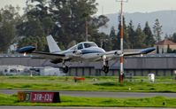 N7589Q @ KRHV - Temptation Motors LTD (Hayward, CA) 1970 Cessna 310Q departing at Reid Hillview Airport, San Jose, CA. - by Chris Leipelt