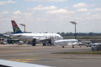ZS-OMB @ JNB - Taken from departing aircraft at JNB. - by Neil Henry