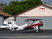 N32135 @ SZP - 1941 Waco UPF-7, Continental W670 220 Hp radial, a stunning showplane with chromed prop & spinner, holding short Rwy 22 - by Doug Robertson