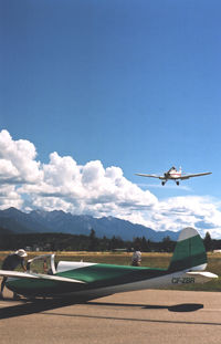 CF-ZBR @ CAA8 - Invermere airport, Pawnee tug landing to tow C-FZBR - by Ray Ochitwa