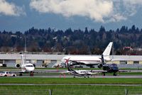 C-GTTD - At YVR with two Canadian Forces CC-144 Challengers,144617 (white) and 144614(black).ABX N767AX in background