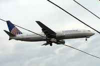N35204 @ CYYZ - Boeing 737-824 [30576] (Continental Airlines) Toronto-Pearson International~C 24/06/2005. Shame about the overhead wire but as it was pre winglet time have added. - by Ray Barber