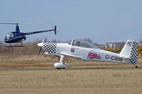 G-CIBM @ EGFH - RV-8, Ravens Fomation Team, Swansea based, taxxing back after practicing at EGFP, seen in its 2016 colour scheme. Heli-Air Wales G-MDKD seen also. - by Derek Flewin
