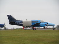 N899AG @ EGTU - One of a pair of US Beech 99 for skydive ops - by magnaman