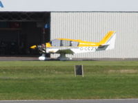 G-CCZX @ EGTE - long shot from long term car park across runway - by magnaman