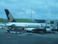 9V-SKK @ NZAA - Seen from departure lounge - by magnaman