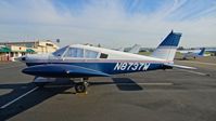 N8737W @ KRHV - Locally-based 1964 Piper PA-28-235 parked on the Nice Air ramp at Reid Hillview Airport, San Jose, CA. - by Chris Leipelt