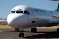 VH-NHG @ YPBO - Fokker 100 of Network Aviation on the platform of Paraburdoo airport, Western Australia, ready to taxi to the runway.