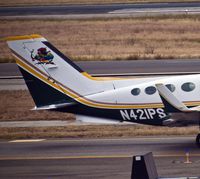 N421PS @ KSNA - This a/c has a parrot for the tail art and is now owned by Always Five Oclock LLC. - by Eric Olsen