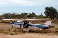 VH-LOD @ YCAR - Cessna 172M at Carnarvon airport Western Australia. It sustained this damage when it was thrown on a fence next to the Shine Aviation hangar at YCAR during cyclone Olwyn, 14-03-2015.
