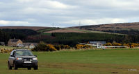 G-CJMY @ X6ET - Crossing the airfield boundary at Easterton, a gliding field 3 miles south of Elgin, Morayshire  - operated jointly by the Highland Gliding Club and the RAF Gliding and Soaring Assoc - by Clive Pattle