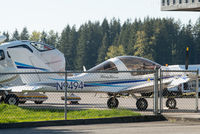 N9494 @ KAWO - Parked at a hanger at north end of airport. - by Remi Farvacque