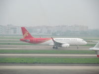B-8411 @ ZGGG - Thankfully I had binoculars to see this as black on red reggies are not good in poor light! - by magnaman
