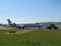 D-AJOY @ EGTE - being towed to opposite side of airport for some TLC - by magnaman