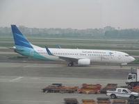 PK-GFD @ ZGGG - nice 737 seen through terminal window. I last saw this in Singapore back in 2011 - by magnaman