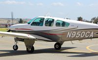 N950CA @ KRHV - Locally-based 1974 Beechcraft V35B taxing to its tie down spot at Reid Hillview Airport, San Jose, CA. - by Chris Leipelt