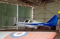 VH-IVP @ YPPF - Lancair IV-P homebuilt aircraft in a hangar of the Classic Jet Fighter museum at Parafield, Adelaide, South Australia
