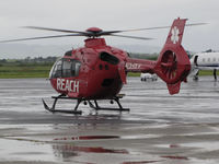 N31RX @ KAPC - REACH/Mediplane (Santa Rosa, CA) 2012 Eurocopter EC-135P2+ waiting for ambulance to pickup and transport patient on rainy ramp @ Napa County Airport, CA - by Steve Nation