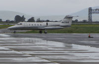 N623KM @ KAPC - Quarry Lane LLC (Chatsworth, CA) 1980 Gates Learjet 35A  arriving from KSJC @ a rainy Napa County Airport, CA (iconic Napa River Railroad Bridge in the background) - by Steve Nation