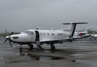 N819SA @ KAPC - SURF AIR 2014 Pilatus PC-12/47E in from KHHR with airstair down @ rainy Napa County Airport, CA - by Steve Nation
