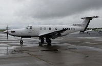 N819SA @ KAPC - SURF AIR 2014 Pilatus PC-12/47E taxis out for return flight to KHHR from rainy Napa County Airport, CA - by Steve Nation