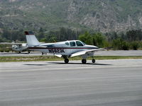 N5623K @ SZP - 1964 Beech 35 B33 DEBONAIR, Continental IO-470-K 225 Hp, landing roll Rwy 22 - by Doug Robertson