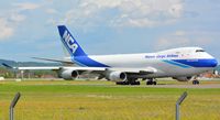 JA07KZ @ LOWG - Nippon Cargo NCA B747-400F turning for take-off from LOWG with the RedBull AirRace planes - by Paul H