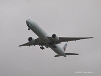 C-FKAU @ KPAE - 777-333ER on take off in the pouring rain on it's delivery flight. - by Eric Olsen