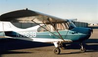 N9069B @ TCY - 69B soon to be disassembled for rebuild. The big hangar at the Tracy airport is seen in the distance.