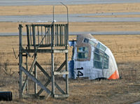 66-4299 @ KSCH - I found this interesting aeronautical artifact lying in a strange position at a remote corner of the airfield through my telephoto lens. - by Daniel L. Berek