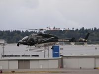 N407KS @ KBFI - Bell 407 going into Boeing Field. - by Eric Olsen